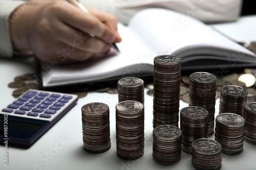 stack of Russian coins on the background of working as an accoun photo