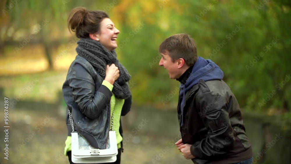 The Guy And the Girl Laugh Loudly on The Autumn Street The Guy And the Girl Laugh Loudly on The Autumn Street