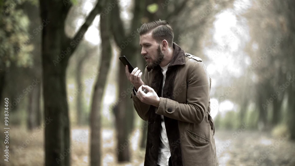 The angry man in expressive way swears by phone edited shots The angry man in expressive way swears by phone edited shots
