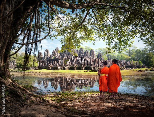 Buddhist monks near Angkor Wat temples in Cambodia photo