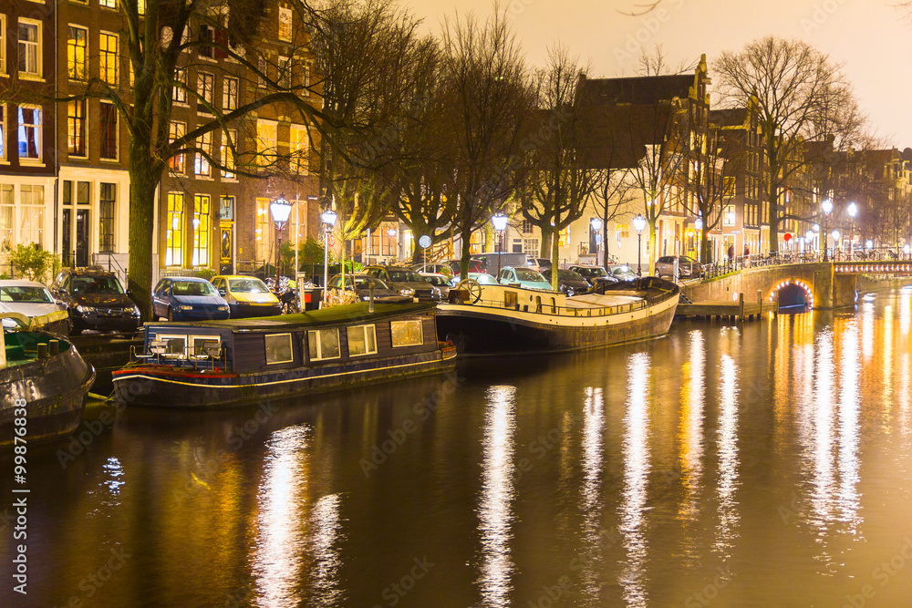 Amsterdam canal and bridge at night
