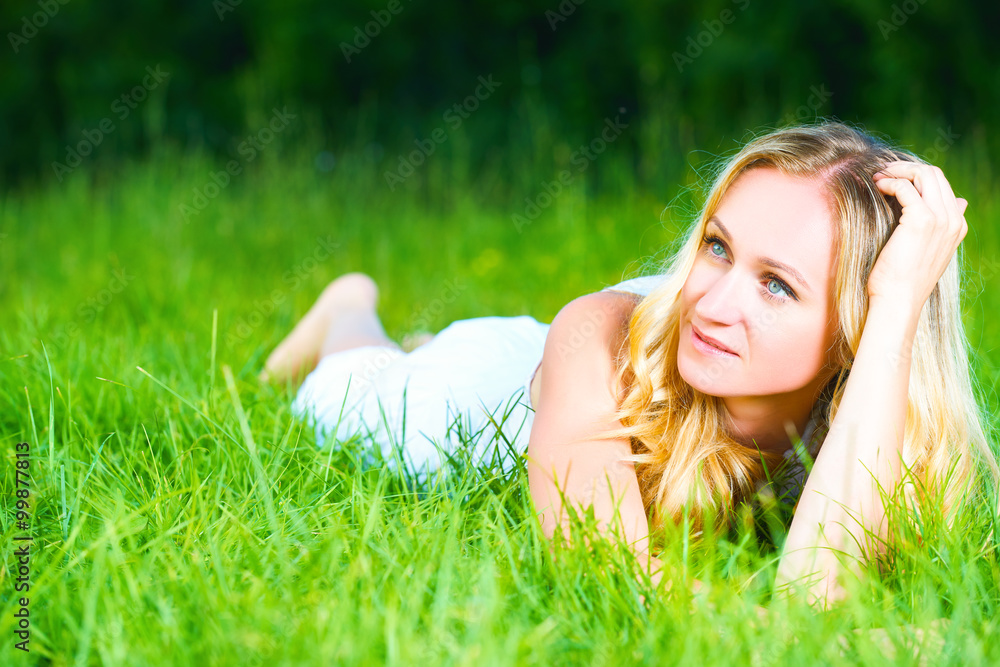 beautiful happy dreamy woman in summer on nature lying on grass beautiful happy dreamy woman in summer on nature lying on grass