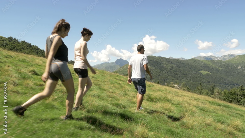Back side view friends hiking and looking around gimbal steadicam Back side view friends hiking and looking around gimbal steadicam