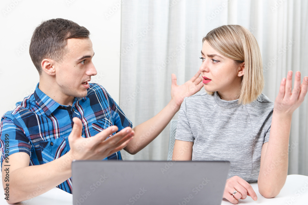 Young man and woman having meeting in the office Young man and woman having meeting in the office
