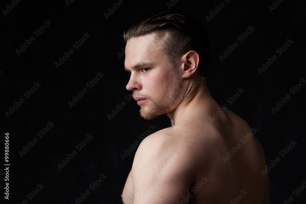 strong man with naked torso, profile