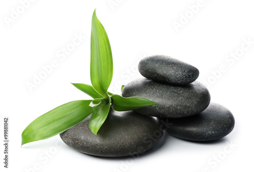 Hot spa stones with bamboo  isolated on white