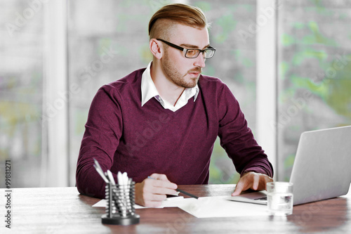 Businessman working with la...