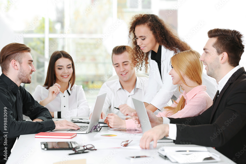 Young business people discussing a new project in a conference room Young business people discussing a new project in a conference room