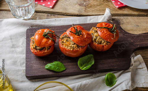 Baked tomatoes stuffed with herbs