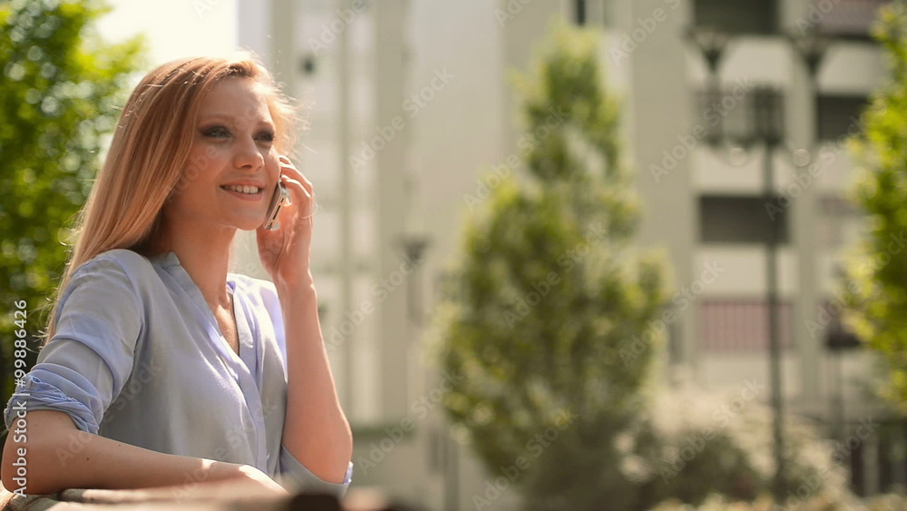 Girl on the smartphone sit on a bech Girl on the smartphone sit on a bech