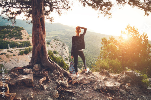 Young woman standing on the...