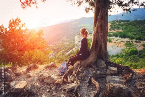 Young woman sitting on the ...