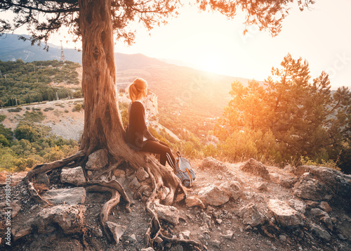 Young woman sitting on the ...
