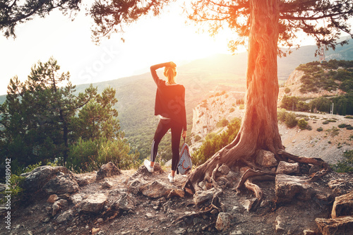 Young woman standing on the...