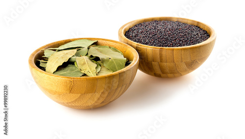 Bay leaves and mustard isolated against white photo