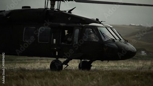 Shot from field of Black Hawk taking off.