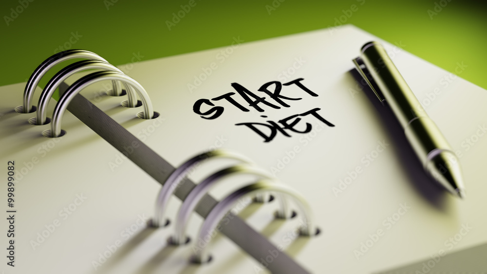Closeup of a personal agenda setting an important date writing w Closeup of a personal agenda setting an important date writing w