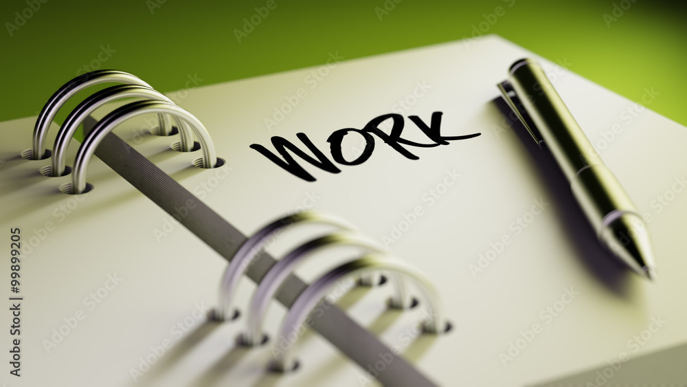 Closeup of a personal agenda setting an important date writing w Closeup of a personal agenda setting an important date writing w