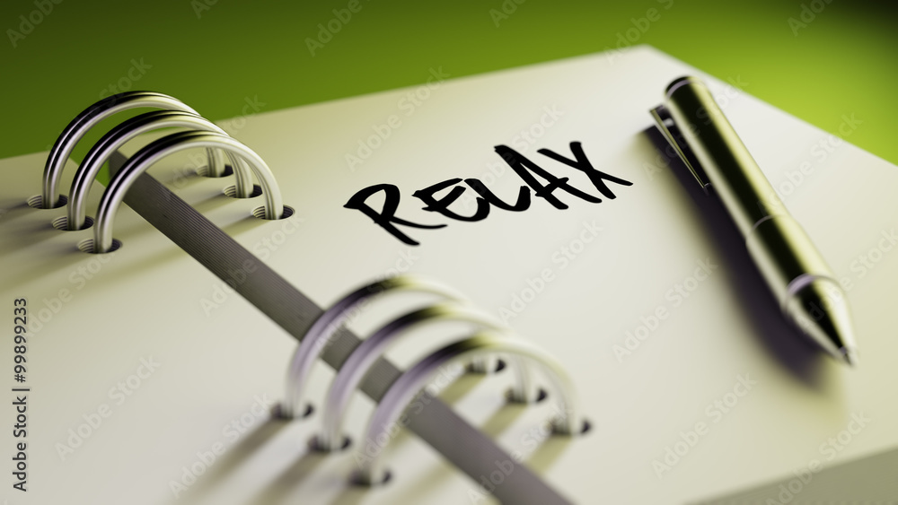 Closeup of a personal agenda setting an important date writing w Closeup of a personal agenda setting an important date writing w