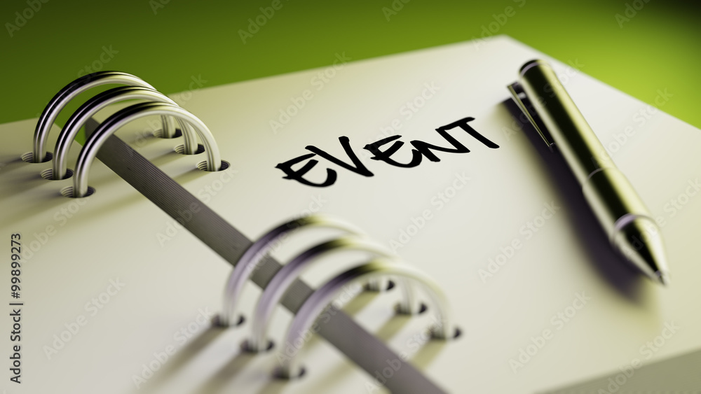 Closeup of a personal agenda setting an important date writing w Closeup of a personal agenda setting an important date writing w
