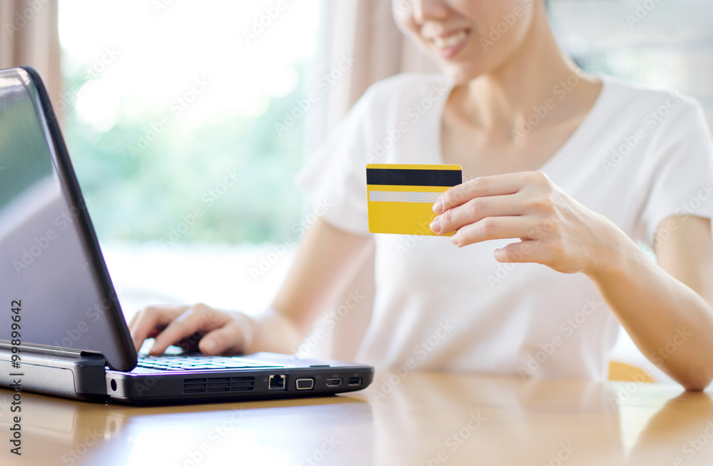 Close up of female hands making online payment Close up of female hands making online payment