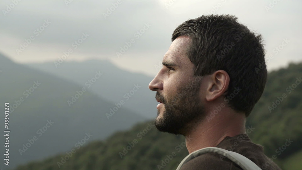Man on mountain is watching panorama in overcast day Man on mountain is watching panorama in overcast day