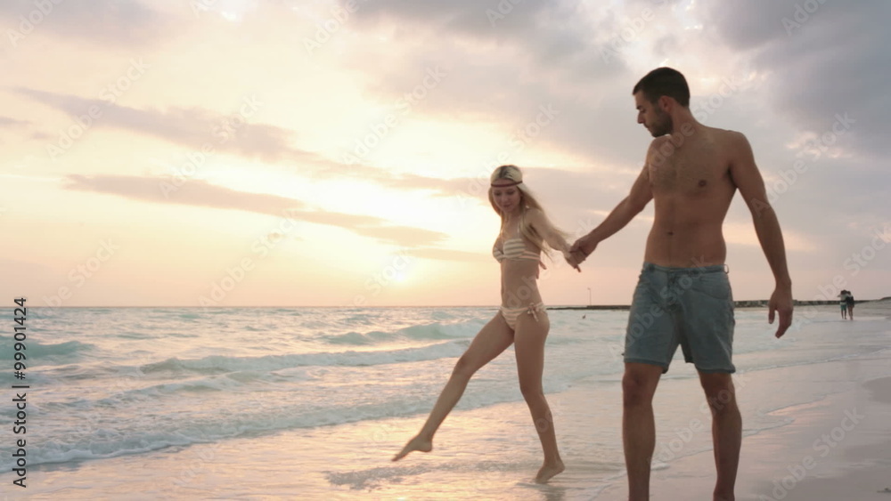 Front view couple walks along sea side gimbal steadicam Front view couple walks along sea side gimbal steadicam