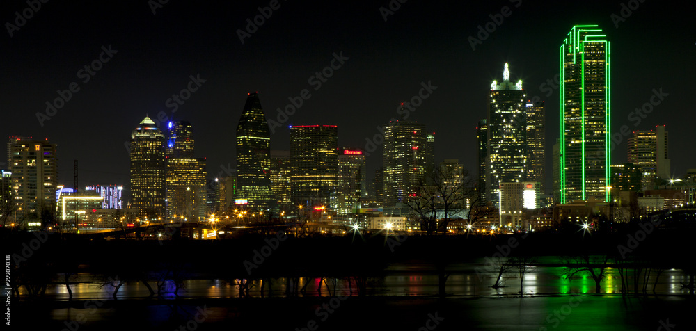 Downtown Dallas, Texas at night with the Trinity River in the foreground