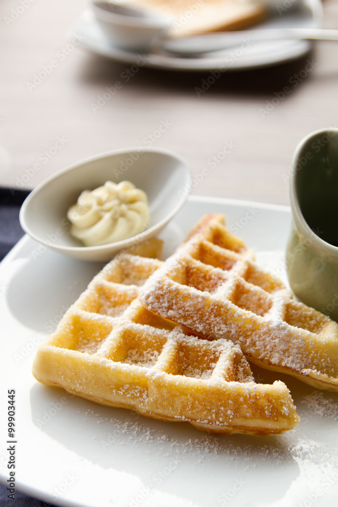 waffle with icing sugar, butter, syrup waffle with icing sugar, butter, syrup