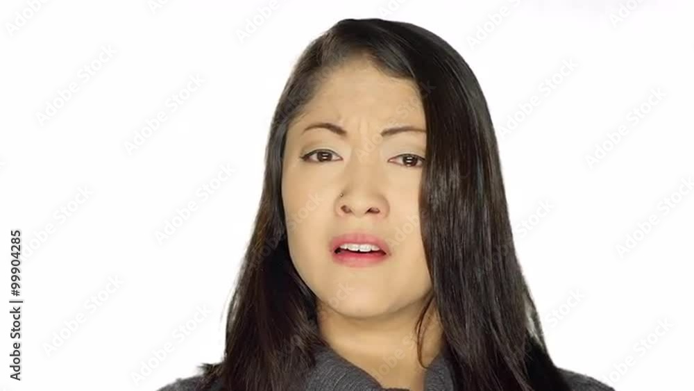 Beautiful ethnic woman beginning to cry, on a white studio background Beautiful ethnic woman beginning to cry, on a white studio background