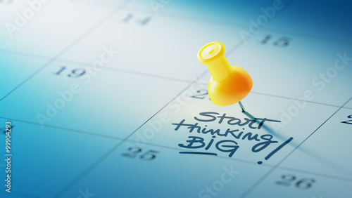 Concept image of a Calendar with a yellow push pin. Closeup shot
