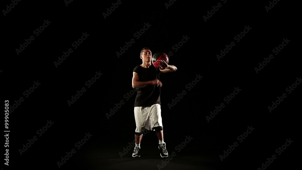 Young athletic sportsman perform basketball freestyle trick Young athletic sportsman perform basketball freestyle trick
