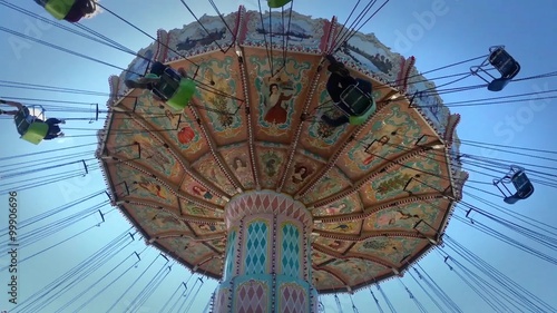 Swing Carousel Or Swing Ride At The Oregon State Fair Against a Blue Background