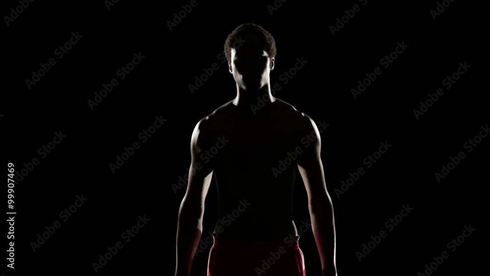 Man stretching isolated on black Man stretching isolated on black