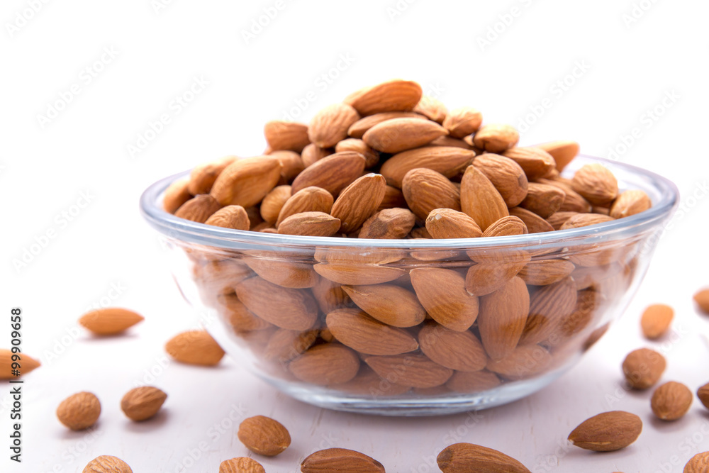 a bowl full of almonds a bowl full of almonds