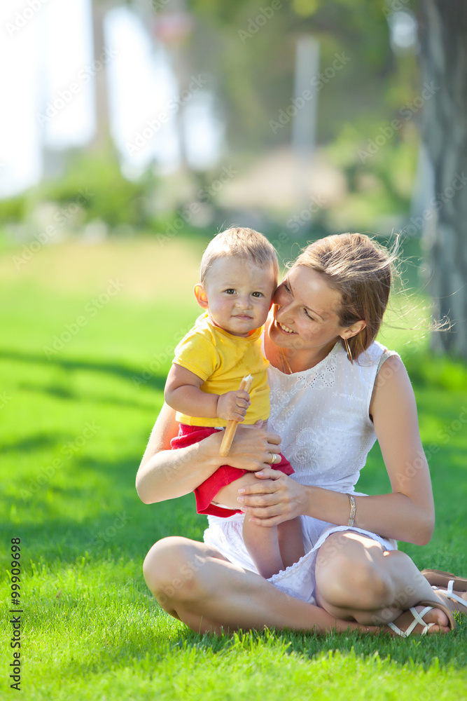 happy mother with her son in nature