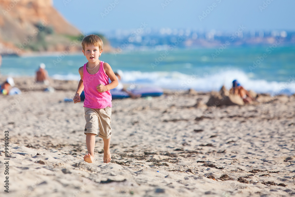 Happy boy are running on the beach Happy boy are running on the beach