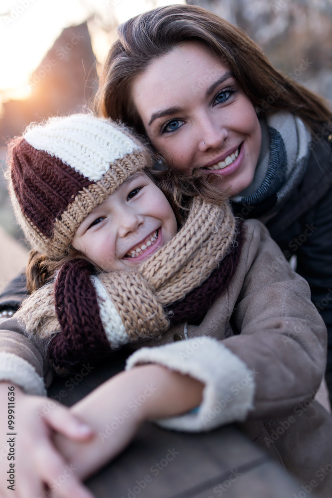 Happy mother and daughter having fun in the street. Happy mother and daughter having fun in the street.