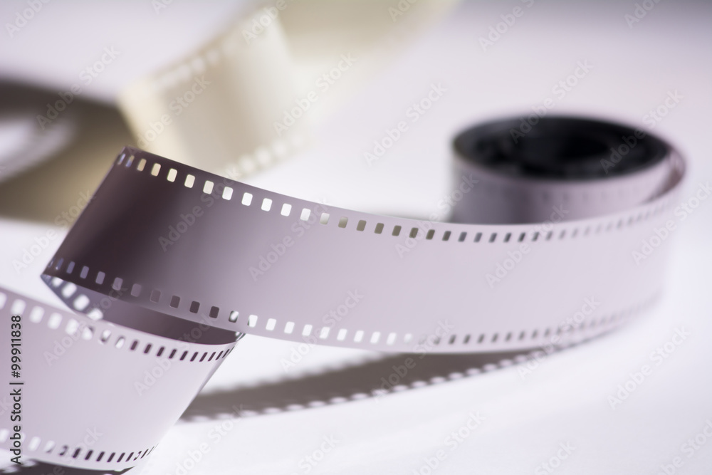 Close-up reel with a negative film. Copy space for announcement