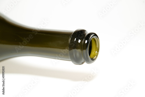 The neck of a wine bottle on white photo