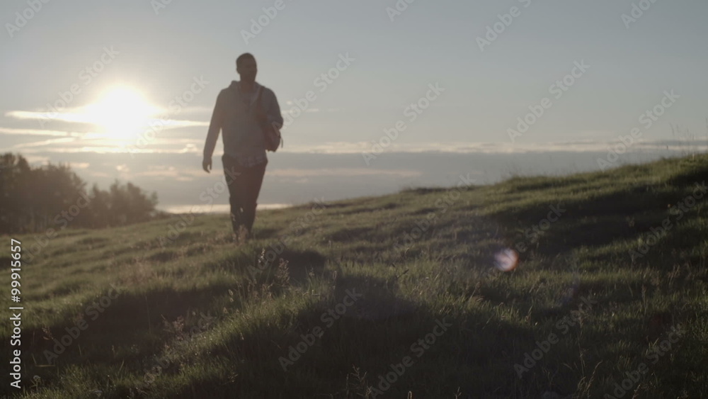 Man hiking toward camera in mountain outdoor nature scenery Man hiking toward camera in mountain outdoor nature scenery