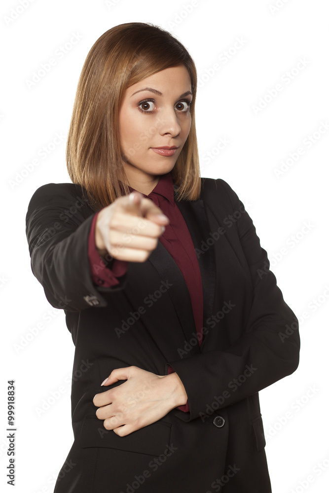 serious business woman pointing a finger at you serious business woman pointing a finger at you