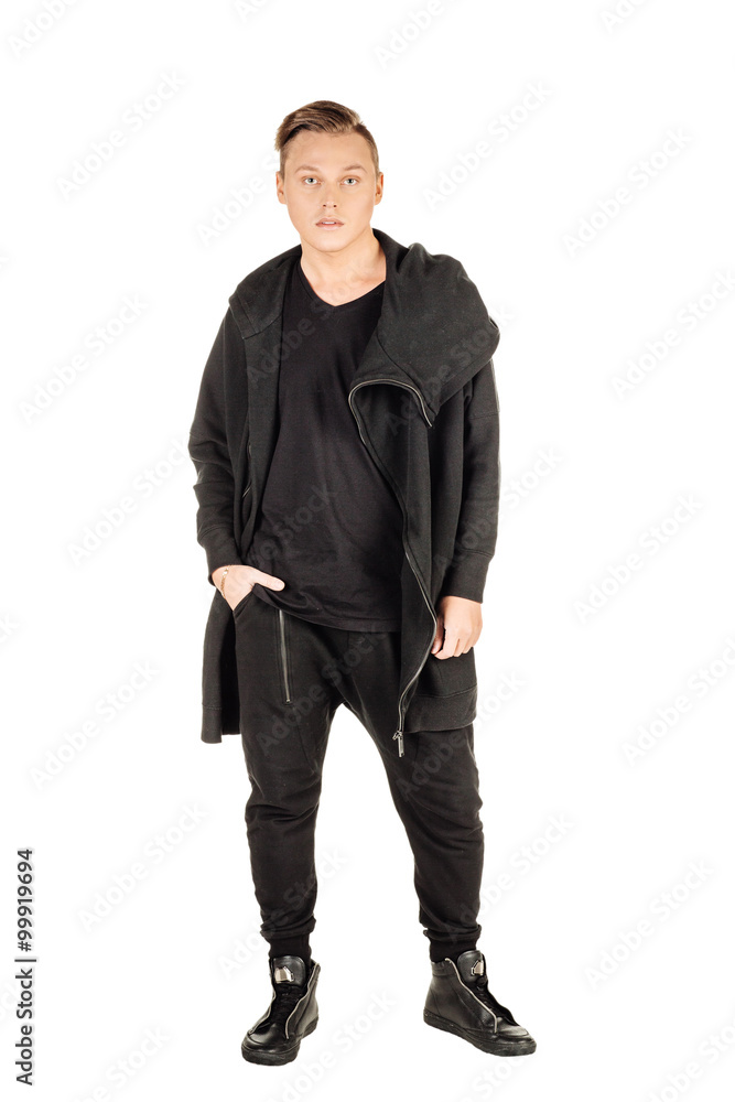 Naklejka premium Full length portrait of a happy male fashion man against wall i