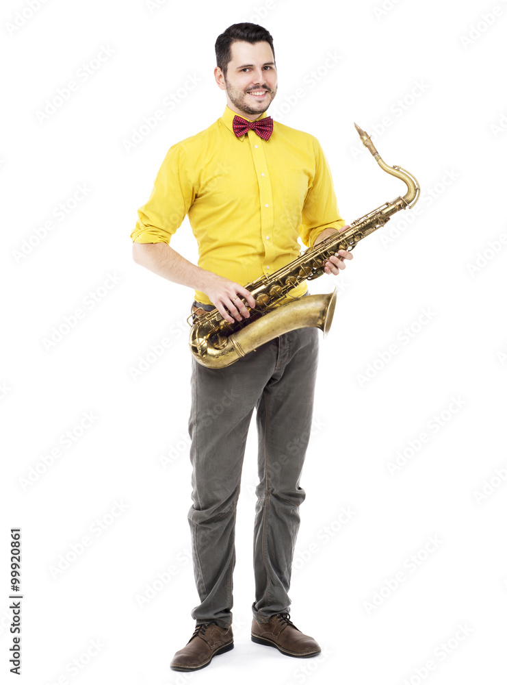 Naklejka premium man saxophonist playing saxophone player in studio isolated on w