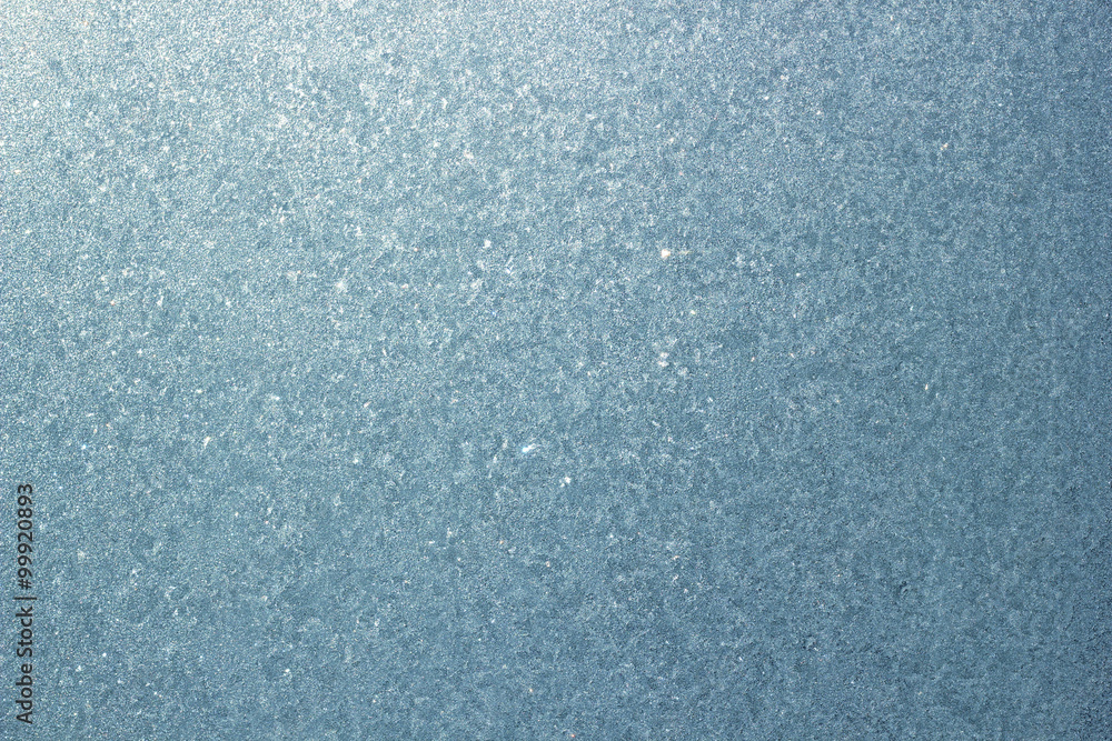 Obraz premium Frozen window background. Ice on the glass. Blue