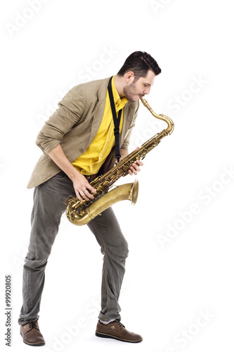 man saxophonist playing saxophone player in studio isolated on w