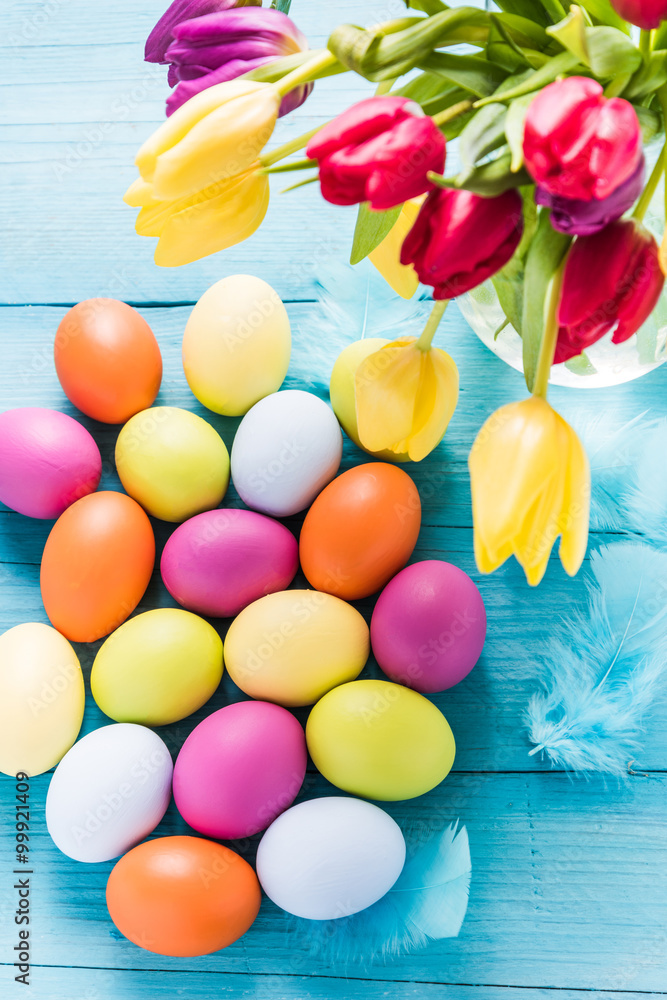 Easter eggs in pastel colors with tulips Easter eggs in pastel colors with tulips