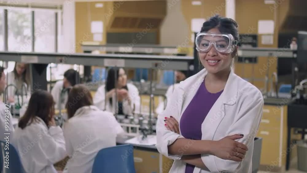 Portrait of a student in a science lab wearing safety goggles and smiling Portrait of a student in a science lab wearing safety goggles and smiling