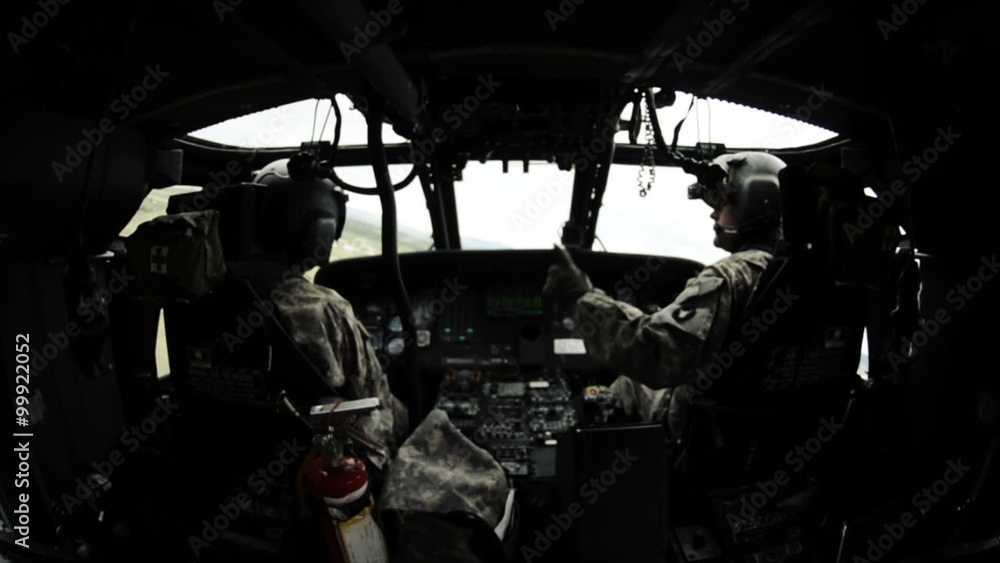 Wide angle shot from in Black Hawk helicopter of the pilots. Wide angle shot from in Black Hawk helicopter of the pilots.