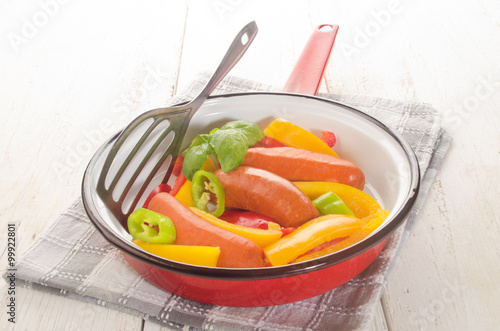 debreziner sausage with green paprika and red bell pepper photo